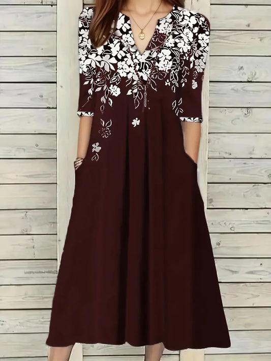 Lässiges Kleid mit V-Ausschnitt und Blumenmuster und halben Ärmeln